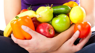 Healthy eating, happy woman with fruits and vegetables, closed-up