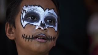A student with his face painted attends a halloween party at a school in Bangkok October 31, 2014. REUTERS/Athit Perawongmetha (THAILAND - Tags: SOCIETY)