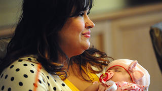 Ruby Graupera-Cassimiro of Deerfield Beach, Fla., holds her newborn daughter, Taily, on November 4, 2014, as she describes her near-death experience after undergoing a scheduled C-section in Septermber 2014. Her heart stopped and a team of more than a dozen medical professionals at Boca Raton Regional Hospital worked more than two hours to revive her. (Mark Randall/Sun Sentinel/MCT via Getty Images)