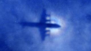 The shadow of a Royal New Zealand Air Force (RNZAF) P3 Orion maritime search aircraft can be seen on low-level clouds as it flies over the southern Indian Ocean looking for missing Malaysian Airlines flight MH370 March 31, 2014. Australian Prime Minister Tony Abbott said on Monday the hunt for Malaysia Airlines Flight MH370 had no time limit, despite the failure of an international operation to find any sign of the plane in three weeks of fruitless searching. A total of 20 aircraft and ships were again scouring a massive area in the Indian Ocean some 2,000 km (1,200 miles) west of Perth, where investigators believe the Boeing 777 carrying 239 people came down.     REUTERS/Rob Griffith/Pool   (AUSTRALIA - Tags: MILITARY TRANSPORT DISASTER)