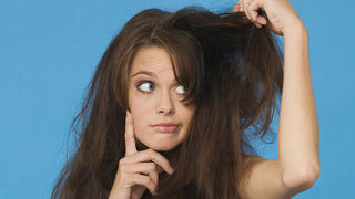 young woman tearing her hair, portrait