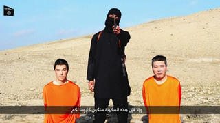 A masked person holding a knife speaks as he stands in between two kneeling men in this still image taken from an online video released by the militant Islamic State group on January 20, 2015. The militant Islamic State group released the online video on Tuesday purporting to show two Japanese captives and threatening to kill them unless it received $200 million in ransom. The black-clad figure with the knife, standing in a barren landscape along with two kneeling men wearing orange clothing, said the Japanese public had 72 hours to pressure their government to stop its "foolish" support for the U.S.-led coalition waging a military campaign against Islamic State. The militant, who spoke in English, demanded "200 million" without specifying a currency, but an Arabic subtitle identified it as U.S. dollars. The footage named the men as Haruna Yukawa and Kenji Goto.   REUTERS/Social media website via Reuters TV     (CIVIL UNREST CONFLICT POLITICS TPX IMAGES OF THE DAY) ATTENTION EDITORS - THIS PICTURE WAS PROVIDED BY A THIRD PARTY. REUTERS IS UNABLE TO INDEPENDENTLY VERIFY THE AUTHENTICITY, CONTENT, LOCATION OR DATE OF THIS IMAGE. FOR EDITORIAL USE ONLY. NOT FOR SALE FOR MARKETING OR ADVERTISING CAMPAIGNS. NO SALES. NO ARCHIVES. THIS PICTURE IS DISTRIBUTED EXACTLY AS RECEIVED BY REUTERS, AS A SERVICE TO CLIENTS