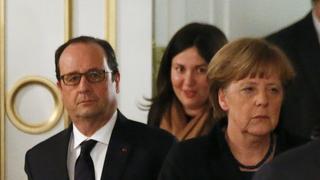 Germany's Chancellor Angela Merkel (R) and France's President Francois Hollande (L) walk as they attend a peace summit to resolve the Ukrainian crisis in Minsk, February 12, 2015. A document seen by Reuters at talks on the Ukraine crisis suggested the sides may agree to end fighting in eastern Ukraine with a ceasefire starting on Feb. 14, the withdrawal of heavy weapons and the creation of a security zone. REUTERS/Vasily Fedosenko (BELARUS  - Tags: POLITICS CIVIL UNREST CONFLICT)  