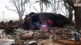 Local residents look through the remains of a small shelter in Port Vila, the capital city of the Pacific island nation of Vanuatu March 14, 2015. Winds of up to 250 kilometers an hour (155 mph) ripped metal roofs off houses and downed trees in Vanuatu on Saturday, as relief agencies braced for a major rescue operation and unconfirmed reports said dozens had already died. Witnesses described sea surges of up to eight meters (yards) and flooding throughout the capital Port Vila after the category 5 cyclone named Pam hit the country late on Friday.   REUTERS/UNICEF Pacific/Handout via Reuters   (VANUATU - Tags: DISASTER ENVIRONMENT) ATTENTION EDITORS - THIS PICTURE WAS PROVIDED BY A THIRD PARTY. REUTERS IS UNABLE TO INDEPENDENTLY VERIFY THE AUTHENTICITY, CONTENT, LOCATION OR DATE OF THIS IMAGE. FOR EDITORIAL USE ONLY. NOT FOR SALE FOR MARKETING OR ADVERTISING CAMPAIGNS. THIS PICTURE IS DISTRIBUTED EXACTLY AS RECEIVED BY REUTERS, AS A SERVICE TO CLIENTS. NO SALES. NO ARCHIVES