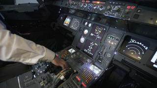 A trainer checks the controls of an Airbus A320 flight simulator in Nova Vas in this November 13, 2014 file photo. The pilot who crashed a Germanwings plane in the French Alps had received a sick note from doctors showing he suffered a health condition that would have prevented him flying the day of the crash, which he apparently hid from his employer, German prosecutors said on March 27, 2015. French prosecutors believe Andreas Lubitz, 27, locked himself alone in the cockpit of the Germanwings Airbus A320 on Tuesday and deliberately steered it into a mountain, killing all 150 people on board.  REUTERS/Srdjan Zivulovic