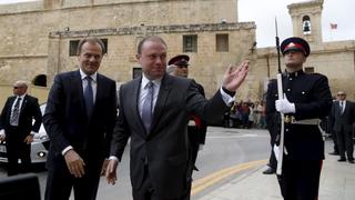 Malta's Prime Minister Joseph Muscat (C) welcomes the President of the European Council, Donald Tusk (L) outside his office at the Auberge de Castille in Valletta March 30, 2015.  They will discuss the situation in Libya, immigration and ways to stabilise the region, among other issues, according to local media.  REUTERS/Darrin Zammit Lupi  MALTA OUT. NO COMMERCIAL OR EDITORIAL SALES IN MALTA	