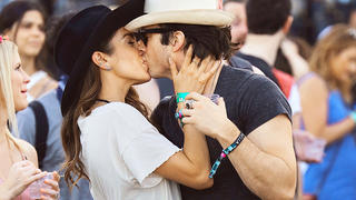Nikki Reed and fiance' Ian Somerhalder were spotted making out while watching a show at Coachella in Indio, CA. The couple were seen showing some major PDA while watching Hozier perform his big hit "Take Me To Church. While making out, a man decided to photobomb the couple with funny faces.