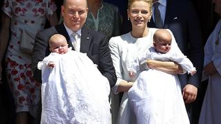 Prince Albert II of Monaco and his wife Princess Charlene hold their twins Prince Jacques (R) and Princess Gabriella (L) as they leave Monaco's Cathedral after their christening ceremony, May 10, 2015.  REUTERS/Eric Gaillard