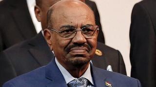 Sudan's President Omar al-Bashir prepares for a group photograph ahead of the African Union summit in Johannesburg June 14, 2015. A South African court issued an interim order on Sunday preventing Bashir leaving the country, where he was attending an African Union summit, until the judge hears an application calling for his arrest. Bashir is accused in an International Criminal Court (ICC) arrest warrant of war crimes and crimes against humanity over atrocities in the Darfur conflict. REUTERS/Siphiwe Sibeko 