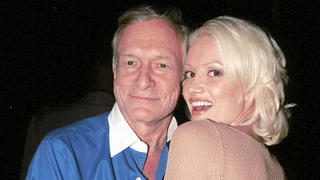 HOLLYWOOD - APRIL 25:  Playboy founder Hugh Hefner poses with playmate Holly Madison at The White Lotus club on April 25, 2003 in Hollywood, California.  (Photo by David Klein/Getty Images)