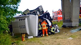 Rescuers stand next to a British bus, which was transporting 34 children before it overturned and crashed on a motorway, near the city of Middelkerke, Belgium, June 28, 2015.  A British bus with 34 children on board overturned and crashed on a motorway in Belgium on Sunday morning, killing a driver, a local mayor said. None of children nor six accompanying adults were seriously injured in the accident, which happened when the driver lost control of the vehicle on a stretch of the E40 motorway near the Belgian coast.   REUTERS/Dominique Jauquet   ATTENTION EDITORS - FOR EDITORIAL USE ONLY. NOT FOR SALE FOR MARKETING OR ADVERTISING CAMPAIGNS. NO SALES. NO ARCHIVES. BELGIUM OUT. NO COMMERCIAL OR EDITORIAL SALES IN BELGIUM	