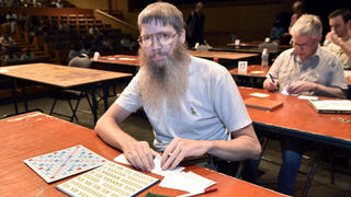 New Zealand's Nigel Richards competes in a category of the Francophone Scrabble World Championships in Louvain-La-Neuve on July 21, 2015.  Nigel Richards, a 48-year-old New Zealander who was crowned the champion of Francophone Scrabble on July 20, doesn't speak a word of French. Bushy-bearded, bespectacled Richards is already a celebrity in the English version of Scrabble, winning its world championship in 2007 and again in 2011.  AFP PHOTO / JOHN THYS  (zu dpa "Sieger bei französischer Scrabble-Meisterschaft ohne Sprachkenntnisse" am 22.07.2015) +++(c) dpa - Bildfunk+++