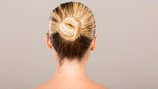 rear view of young woman with hair bun