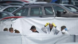 Crash investigors inspect the site of an airplane crash at the British Car Auctions lot next to Blackbushe Airport, near Camberley, in southern Britain August 1, 2015.  The private jet crashed in southern England on Friday, killing four people on board, a spokesman for Britain's Hampshire police service said, and Saudi and British media said the passengers were relatives of deceased al Qaeda leader Osama Bin Laden. REUTERS/Luke MacGregor