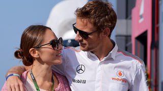 ARCHIV - British Formula One driver Jenson Button of McLaren Mercedes and his girlfriend Jessica Michibata arrive at the paddock at the Nuerburgring race track, Nuerburg, Germany, 06 July 2013. Photo: David Ebener/dpa (zu dpa «12» vom 01.01.2015) +++(c) dpa - Bildfunk+++