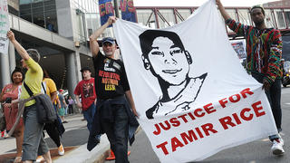 Jun 9, 2015; Cleveland, OH, USA; Tadar Muhammad (right) and Jeremy Brustein (left) demonstrate in support of Tamir Rice outside of Quicken Loans Arena prior to game three of the NBA Finals. Mandatory Credit: Ken Blaze-USA TODAY Sports