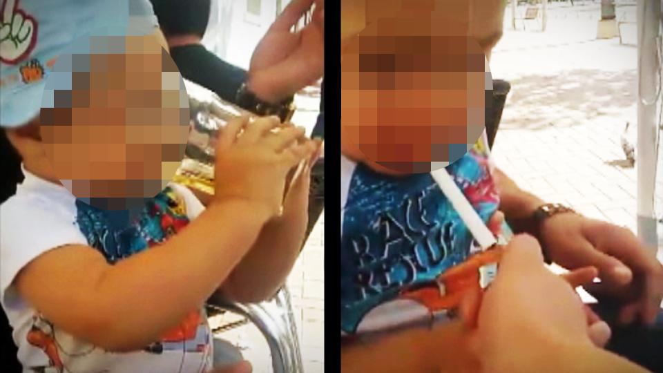 Schockierendes Video: Männer geben Kind Alkohol und Zigaretten.