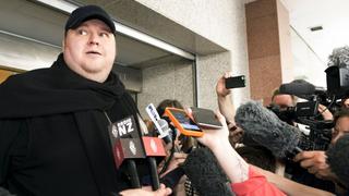 REFILE - ADDING RESTRICTIONSGerman tech entrepreneur Kim Dotcom speaks to the press after appearing in an Auckland courthouse, December 23, 2015. A New Zealand court ruled on Wednesday that Dotcom can be extradited to the United States to face charges of copyright infringement, racketeering and money laundering.   REUTERS/Chris Cameron        EDITORIAL USE ONLY. NO RESALES. NO ARCHIVE