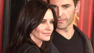 HOLLYWOOD, CA - NOVEMBER 05:  Actress Courteney Cox (L) and musician Johnny McDaid arrive  premiere of HBO's 'The Comeback'  at the El Capitan Theatre on November 5, 2014 in Hollywood, California.  (Photo by Frazer Harrison/Getty Images)