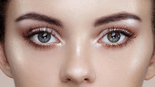 Beautiful woman face. Perfect makeup. Beauty fashion. Eyelashes. Cosmetic Eyeshadow. Highlighting