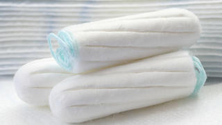 health care and medicine - white tampons on blue background