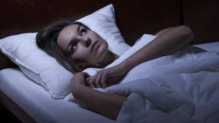View of woman feeling depression in bed