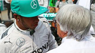 (L to R): Lewis Hamilton (GBR) Mercedes AMG F1 with Bernie Ecclestone (GBR) on the grid.30.03.2014. Formula 1 World Championship, Rd 2, Malaysian Grand Prix, Sepang, Malaysia, Sunday.- www.xpbimages.com, EMail: requests@xpbimages.com - copy of publication required for printed pictures. Every used picture is fee-liable. © Copyright: Batchelor / XPB Images