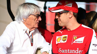 BAHRAIN, BAHRAIN - APRIL 17:  F1 supremo Bernie Ecclestone chats with Sebastian Vettel of Germany and Ferrari  during practice for the Bahrain Formula One Grand Prix at Bahrain International Circuit on April 17, 2015 in Bahrain, Bahrain.  (Photo by Mark Thompson/Getty Images)