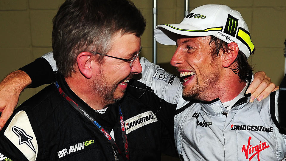SAO PAULO, BRAZIL - OCTOBER 18:  Jenson Button (R) of Great Britain and Brawn GP is congratulated by Brawn GP Team Principal Ross Brawn (L) after clinching the F1 World Drivers Championship during the Brazilian Formula One Grand Prix at the Interlago