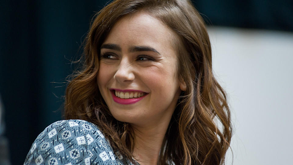 Lily Collins attends a Q&A and autograph session for fans in anticipation of Screen Gems' action-fantasy THE MORTAL INSTRUMENTS: CITY OF BONES at Chicago Ridge Mall on July 30, 2013 in Chicago Ridge, Illinois.  (Photo by