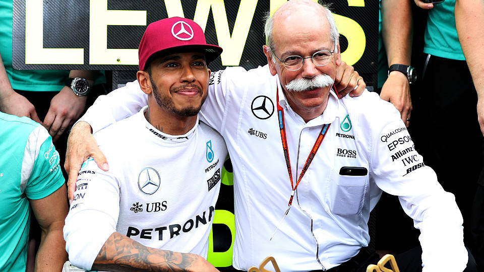 MONTE-CARLO, MONACO - MAY 29:  Lewis Hamilton of Great Britain and Mercedes GP celebrates his win with Dieter Zetsche, Chairman of the Board of Directors of Daimler AG and Head of Mercedes-Benz Cars and his team during the Monaco Formula One Grand Prix at Circuit de Monaco on May 29, 2016 in Monte-Carlo, Monaco.  (Photo by Mark Thompson/Getty Images)
