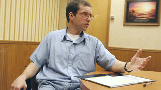 In this photo taken Wednesday, March 9, 2011, Jens Soering speaks during an interview at the Buckingham Correctional Center in Dillwyn, Va. Soering, a former German diplomat's son who is serving life in prison for killing two people, is hoping new evidence will win his parole. Meanwhile, the woman convicted of helping him kill her parents maintains they are both guilty and belong in prison. (AP Photo/Steve Helber) |