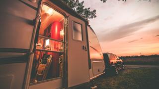 Travel Trailer Camping. RV Trip Theme. Evening in RV . Vintage Color Grading.