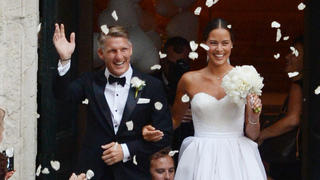 Bastian Schweinsteiger and Ana Ivanovic newlyweds wave at the crowd before departing on a boat in Venice, Italy