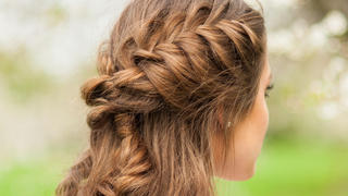 Girl with beautiful  braid hairstyle, rear view