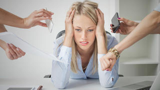 Pressure at work: depressed business woman