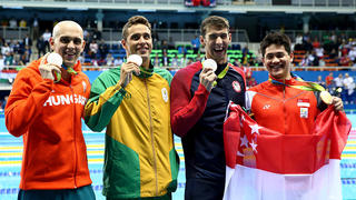 RIO DE JANEIRO, BRAZIL - AUGUST 12:  Joint silver medalists, Michael Phelps of United States, Chad Guy Bertrand le Clos of South Africa, Laszlo Cseh of Hungary and gold medalist Joseph Schooling of Singapore celebrate after the medals ceremony in the Men's 100m Butterfly Final on Day 7 of the Rio 2016 Olympic Games at the Olympic Aquatics Stadium on August 12, 2016 in Rio de Janeiro, Brazil.  (Photo by Al Bello/Getty Images)