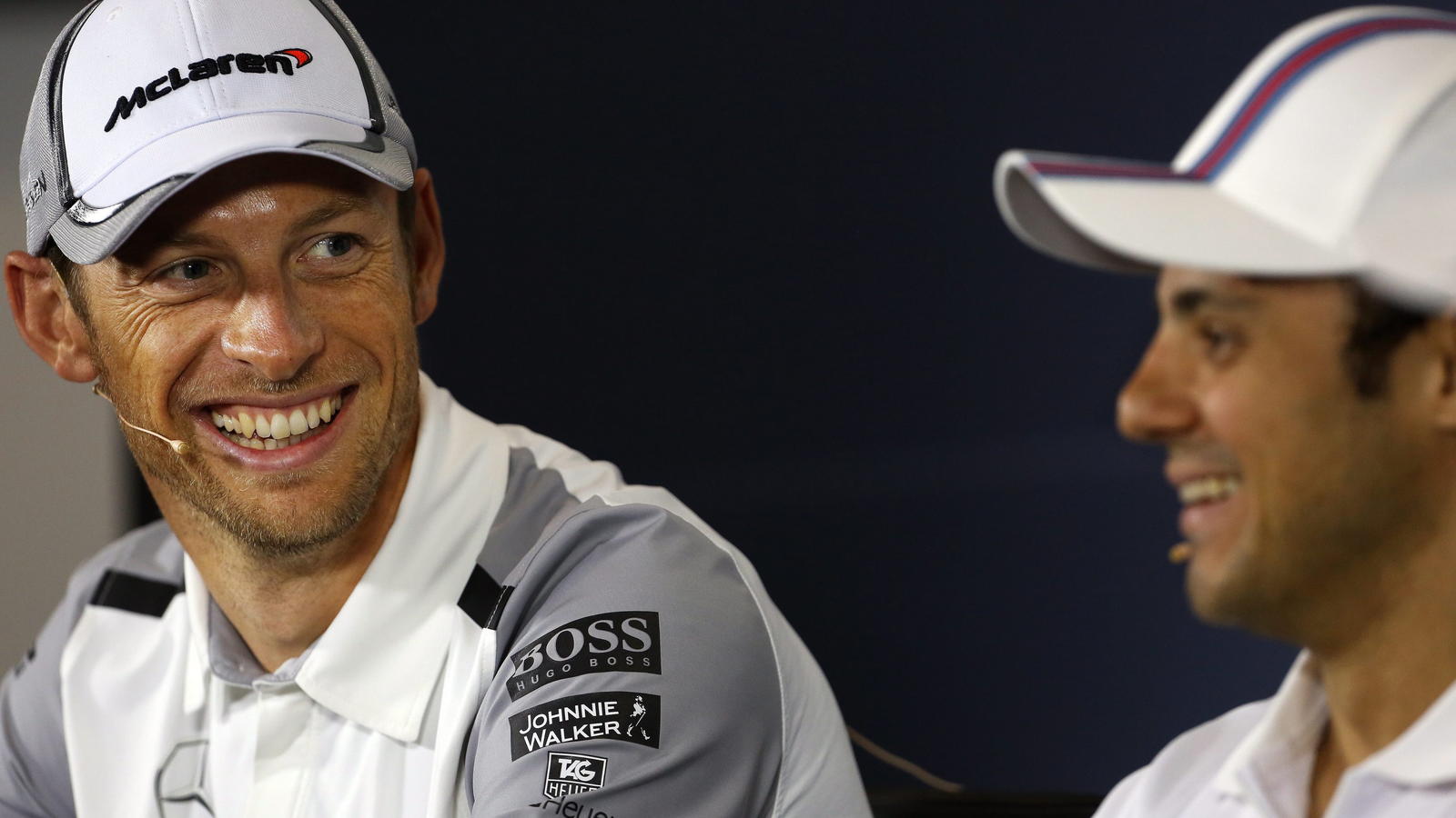 FILE - epa04296919 British Formula One driver Jenson Button (L) of McLaren and Brazilian Formula One driver Felipe Massa (R) of Williams share a joke during the drivers press conference at Silverstone race track ahead of the Formula One Grand Prix of