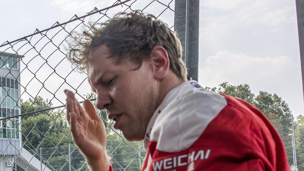 epa05522266 German Formula One driver Sebastian Vettel of Scuderia Ferrari reacts after the qualifying session at the at the Formula One circuit in Monza, Italy, 03 September 2016. Vettel jumped the fence after qualifying to give a wave to the crowd 