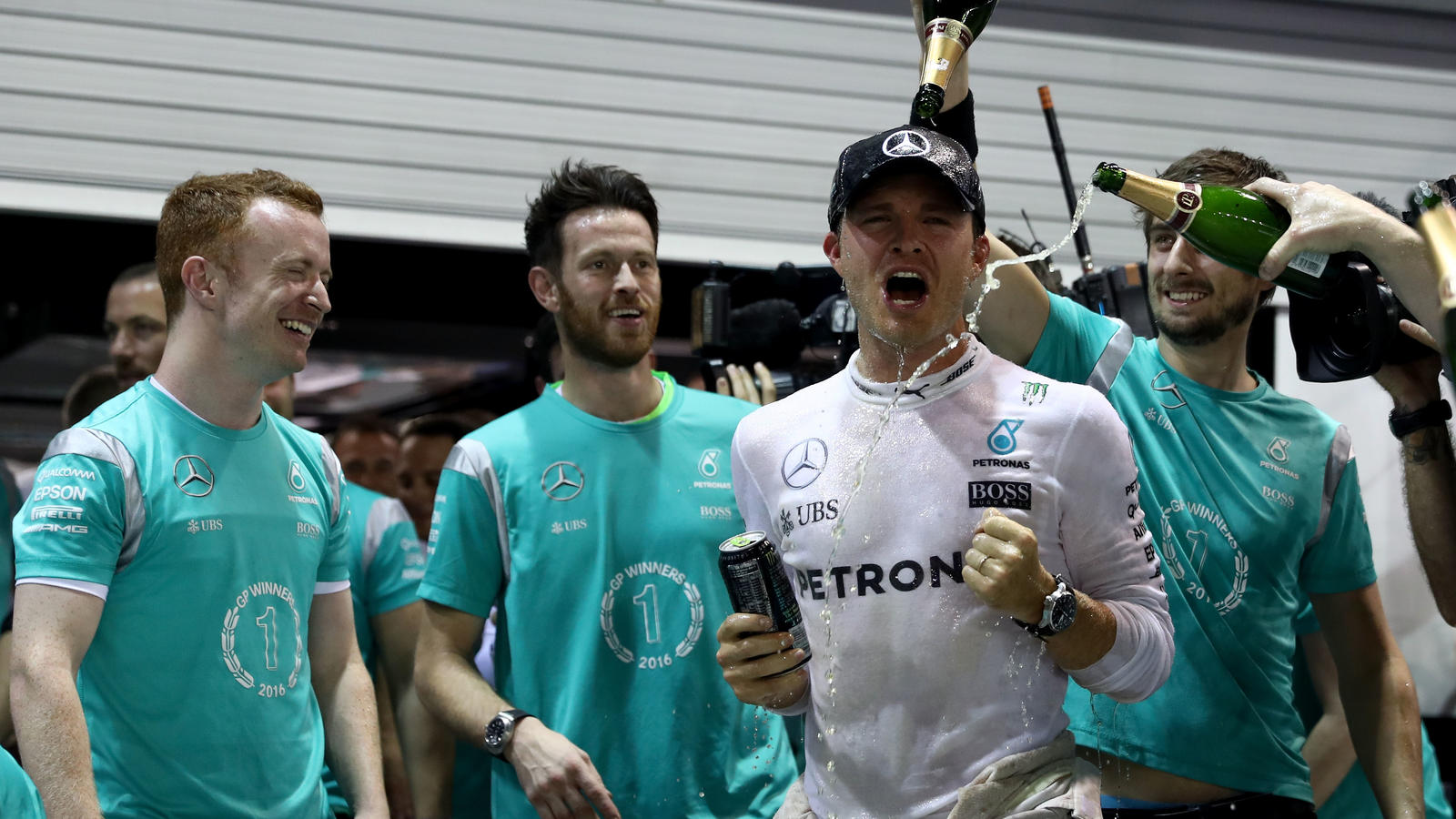 SINGAPORE - SEPTEMBER 18:  Nico Rosberg of Germany and Mercedes GP celebrates his win with his team  during the Formula One Grand Prix of Singapore at Marina Bay Street Circuit on September 18, 2016 in Singapore.  (Photo by Lars Baron/Getty Images)