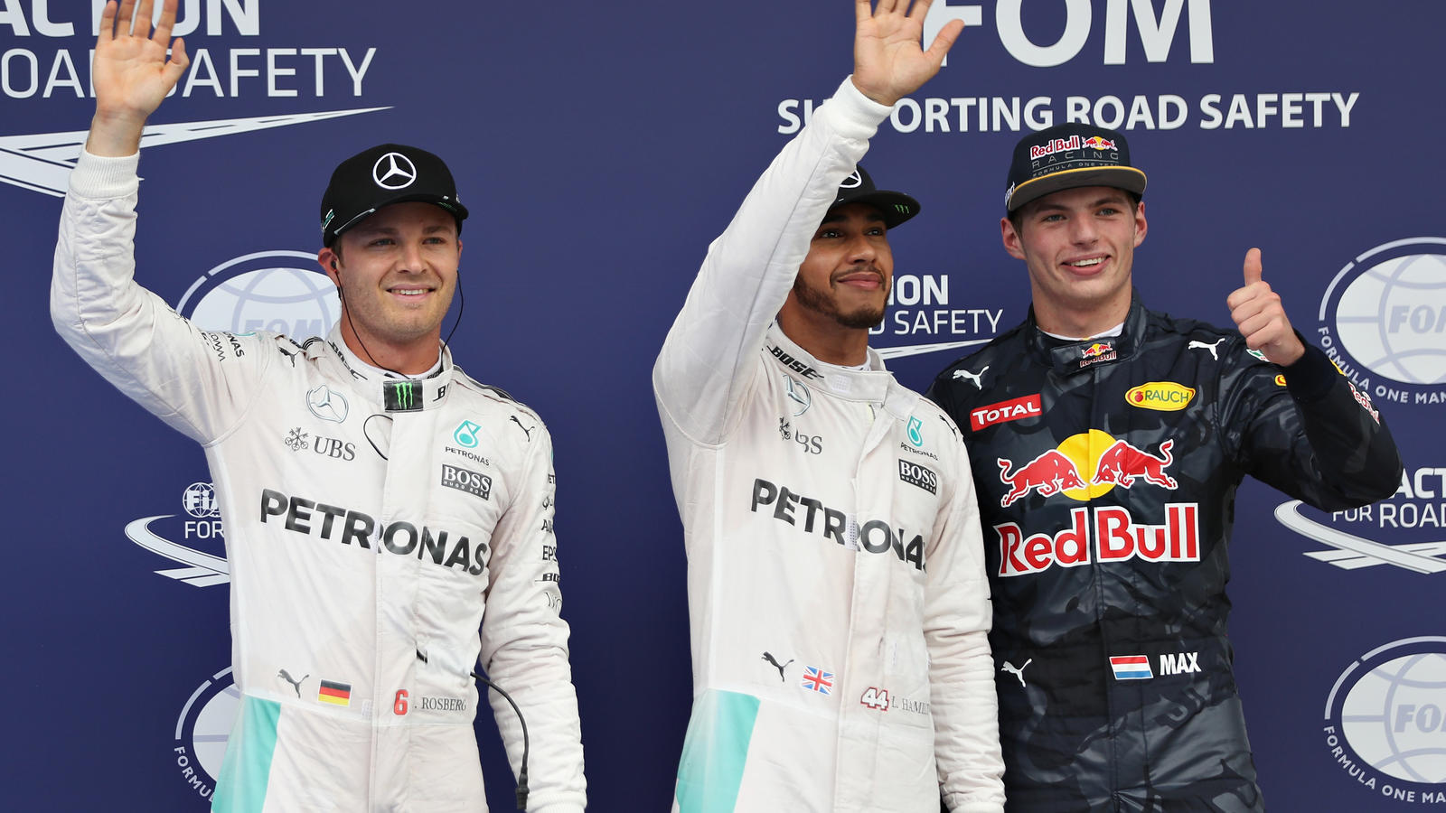 KUALA LUMPUR, MALAYSIA - OCTOBER 01:  Top three qualifiers Lewis Hamilton of Great Britain and Mercedes GP, Nico Rosberg of Germany and Mercedes GP and Max Verstappen of Netherlands and Red Bull Racing wave to the crowd in parc ferme during qualifyin