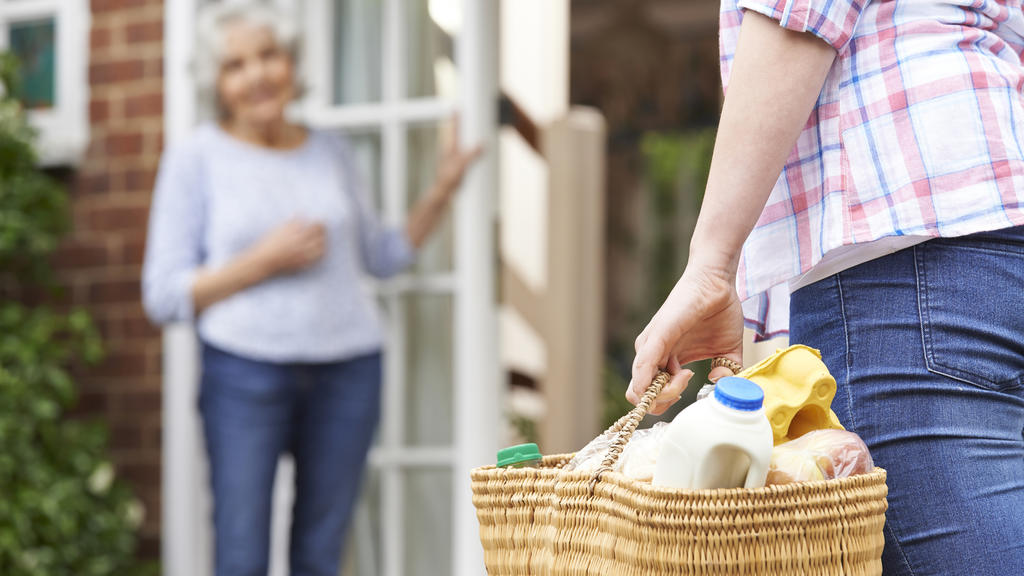 Person Doing Shopping For Elderly Neighbour