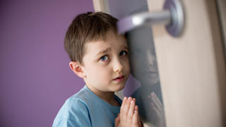 Little boy overhears fight of his parents through the door