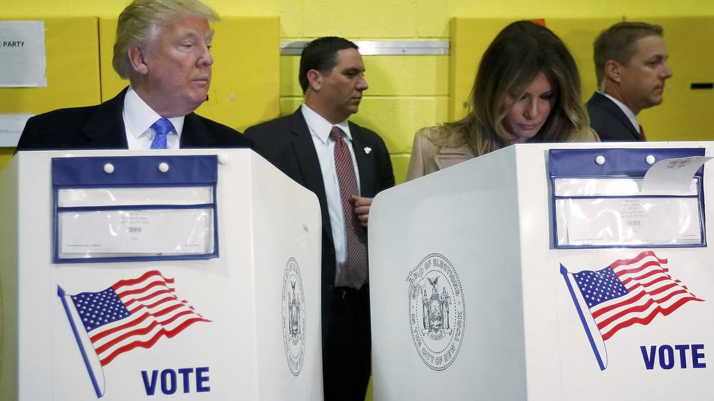 Republican presidential nominee Donald Trump and his wife Melania Trump vote at PS 59 in New York, New York, U.S. November 8, 2016. REUTERS/Carlo Allegri