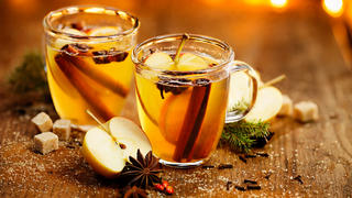 Hot cider with addition of cinnamon sticks, anise stars, cloves and citrus fruits