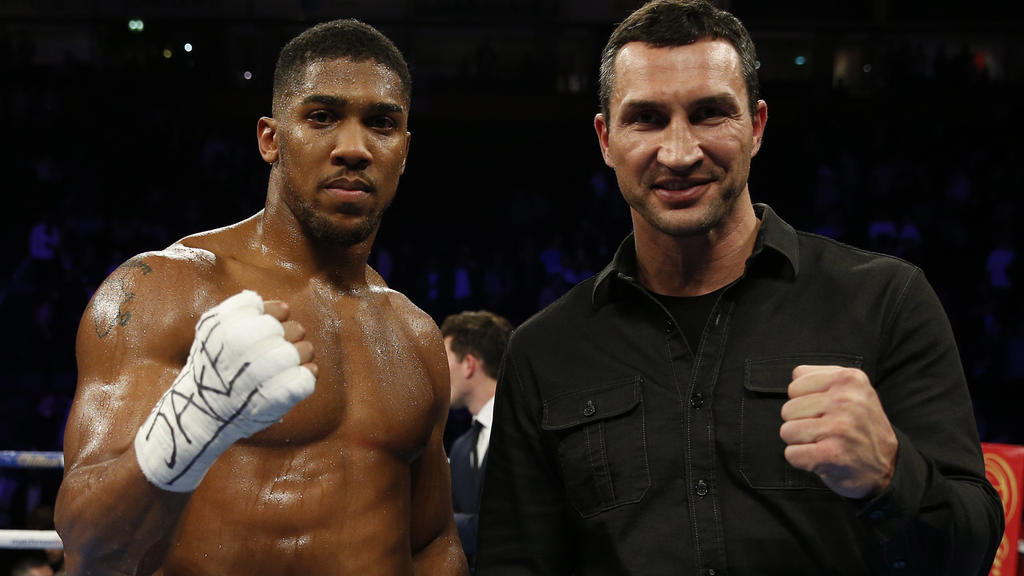 Boxing Britain - Anthony Joshua v Eric Molina IBF World Heavyweight Title - Manchester Arena - 10/12/16 Anthony Joshua celebrates his win with Wladimir Klitschko Action Images via Reuters / Andrew Couldridge Livepic EDITORIAL USE ONLY.