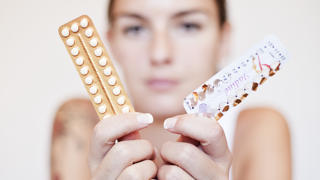 Young woman with contraceptive pills, birth-control pill, blister pack of combined oral contraceptive pills, birth control, prevention of pregnancy. (CTK Photo/Josef Horazny, Martin Sterba)