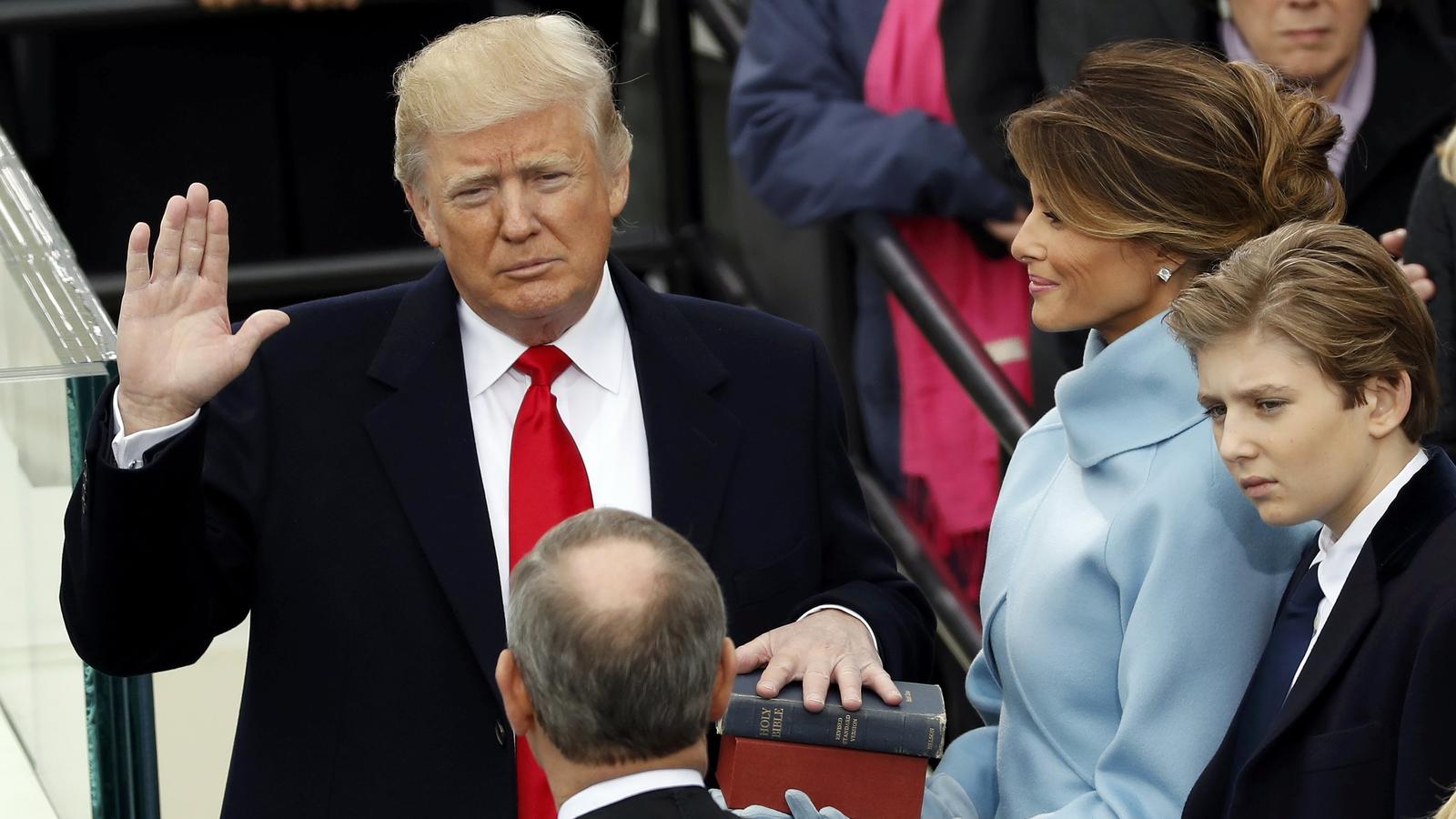 US President Donald Trump takes the oath of office with his wife Melania and son Barron at his side, during his inauguration at the U.S. Capitol in Washington, U.S., January 20, 2017. REUTERS/Kevin Lamarque