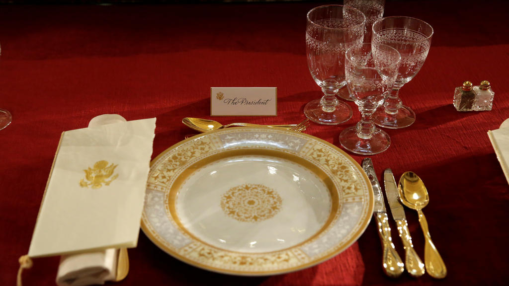 A table is prepared for U.S. President Donald Trump before the Inaugural Luncheon with members of Congress in Statuary Hall on Capitol Hill in Washington, U.S., January 20, 2017. REUTERS/Yuri Gripas