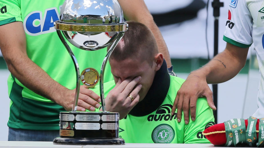 Football Soccer - Chapecoense v Palmeiras - Charity match - Arena Conda, Chapeco, Brazil, 21/1/17. Goalkeeper Jackson Follmann, who survived when the plane carrying Brazilian soccer team Chapecoense crashed, reacts as he receives the Copa Sudamerica